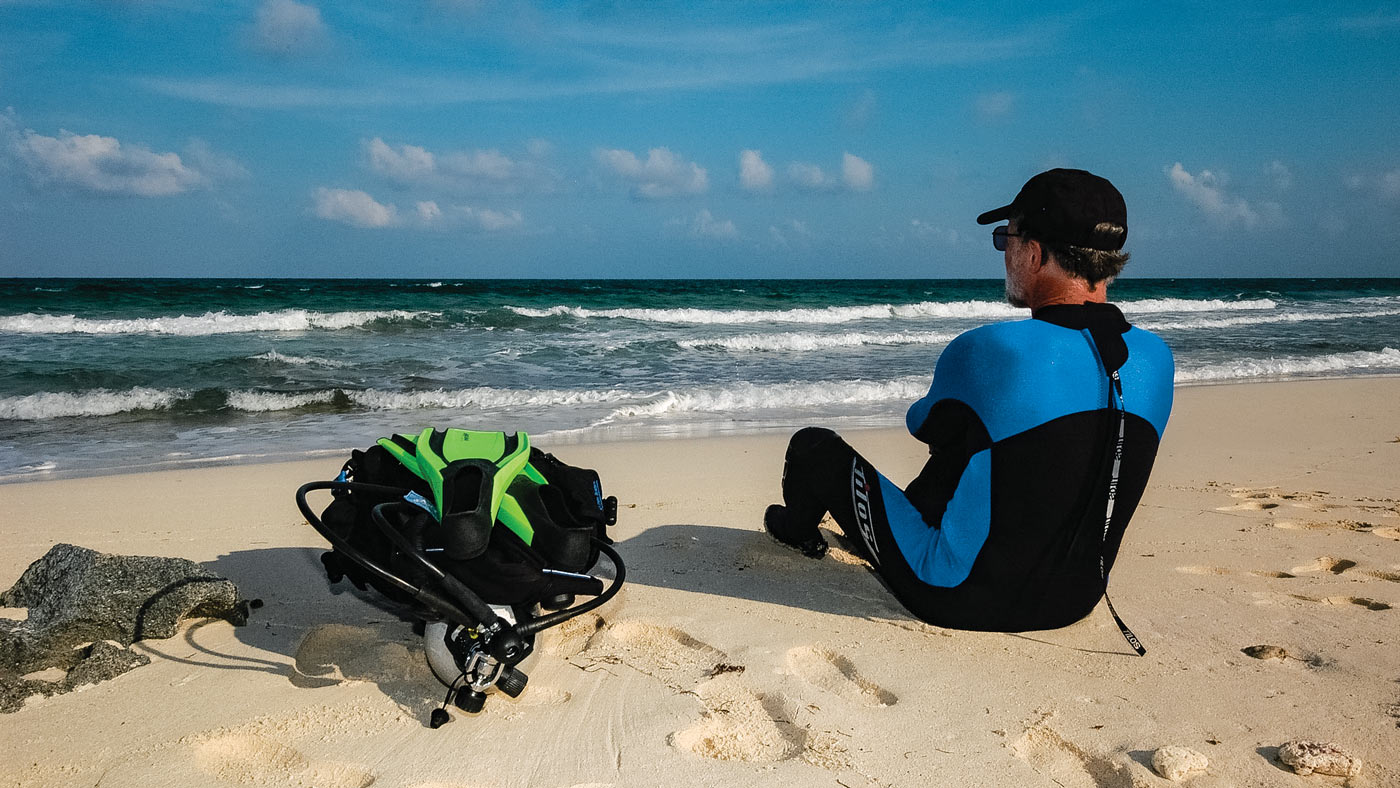 scuba diver on shore